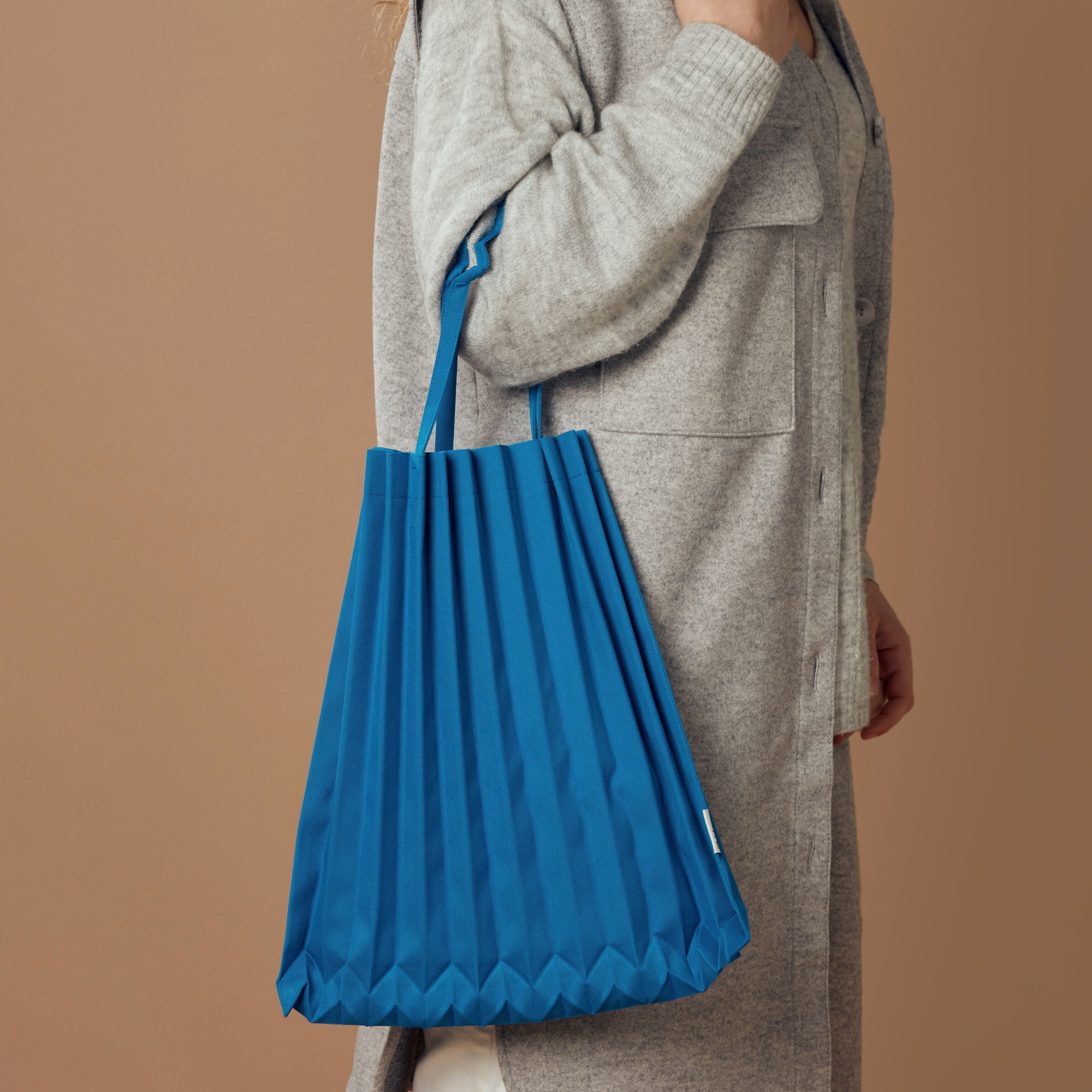 me ISSEY MIYAKE Recycled Polyester Trunk Pleats Bag Cobalt Blue MoMA Design Store