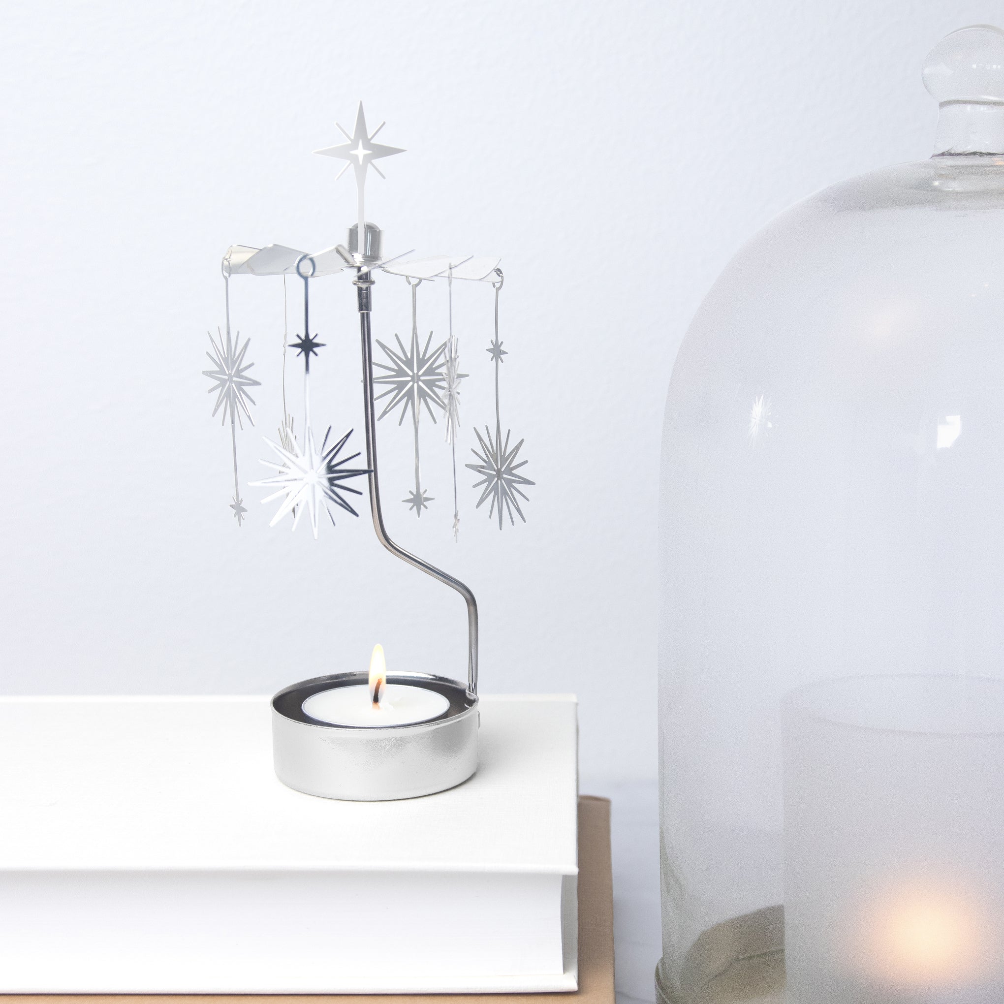 Silver Supernova Rotary Tea Light Candle Holder – MoMA Design Store